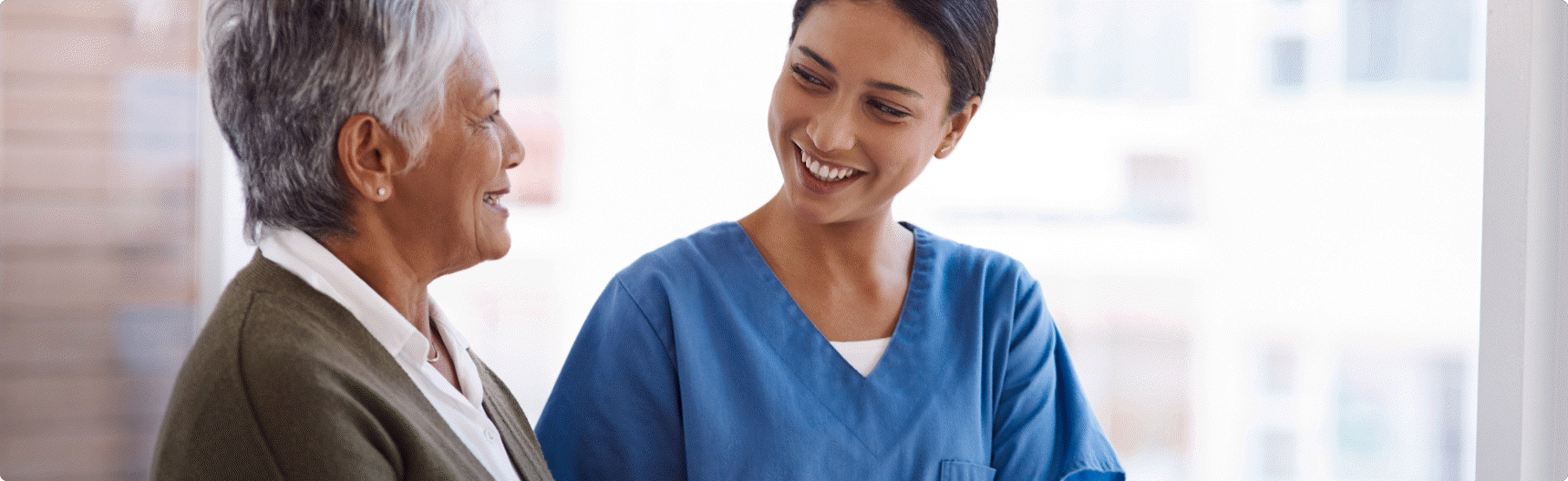 Two women laughing together