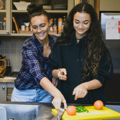 Mother and daughter prepare a meal