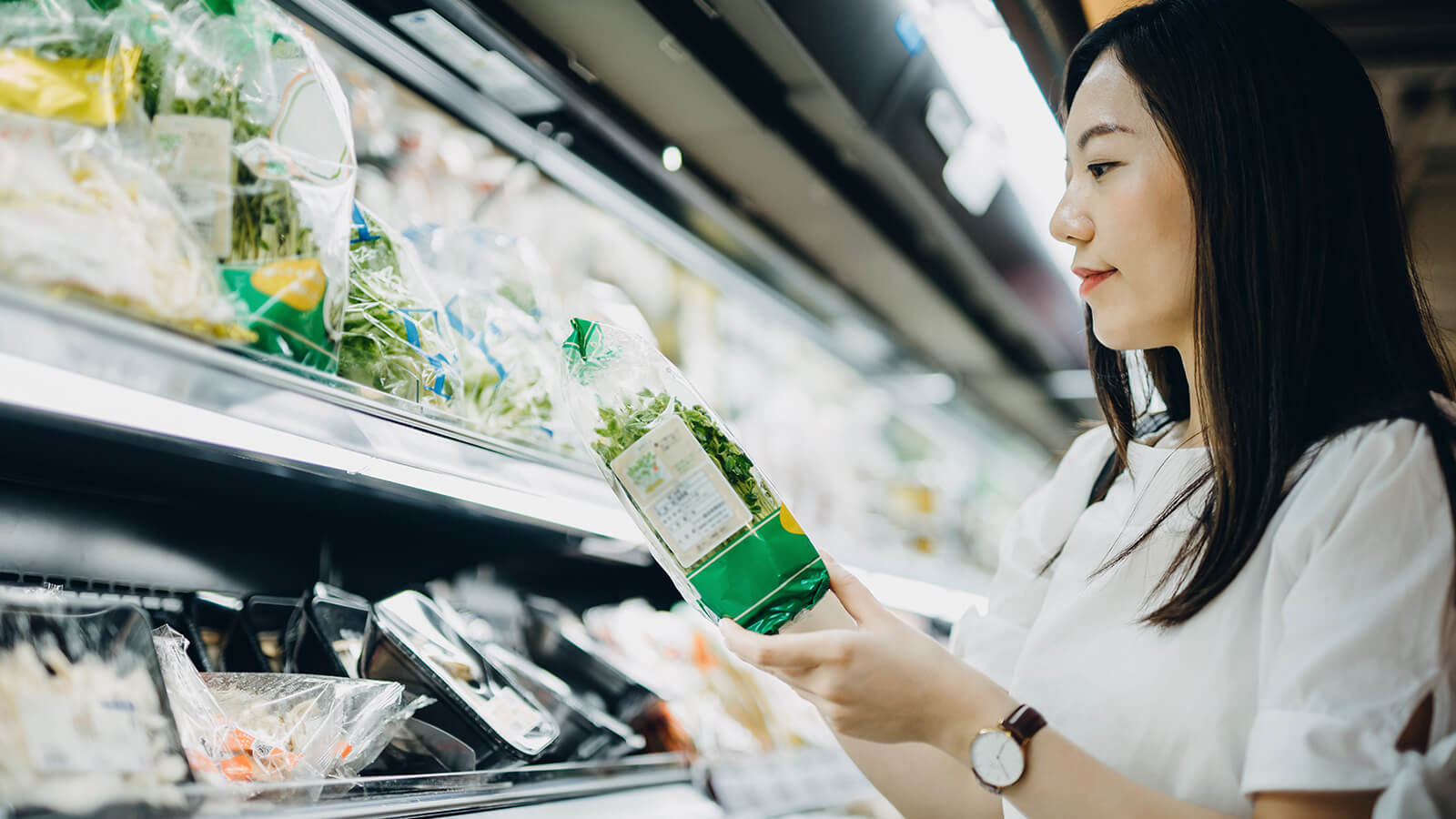 Southern Cross - A woman buys vegetables at the supermarket A woman buys vegetables at the supermarket