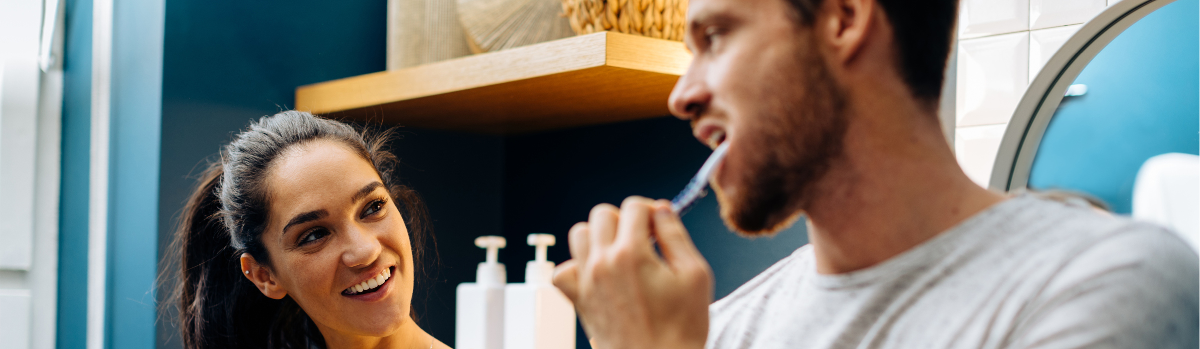 Southern Cross - A man brushes his teeth while talking to a woman in the bathroom A man brushes his teeth while talking to a woman in the bathroom
