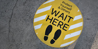 Being prepared for anything A social distancing sign on the footpath