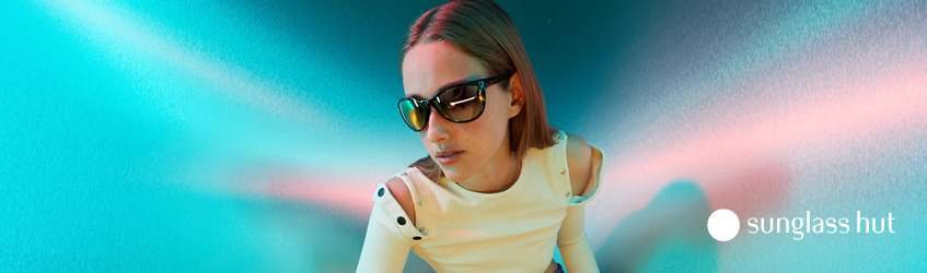 A woman wears sunglass hut glasses