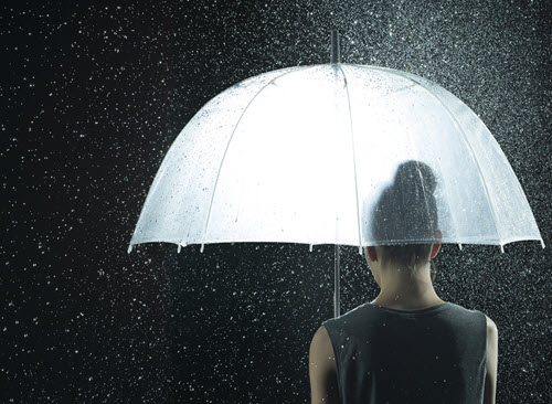 Southern Cross NZ - security assurance A woman holding an umbrella