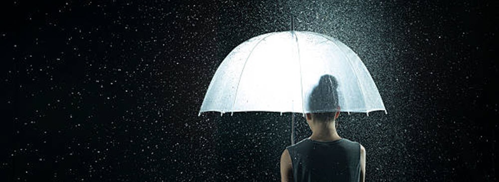 Southern Cross NZ - security assurance A woman holding an umbrella